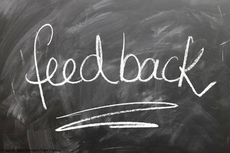 The word 'feedback' written on a blackboard