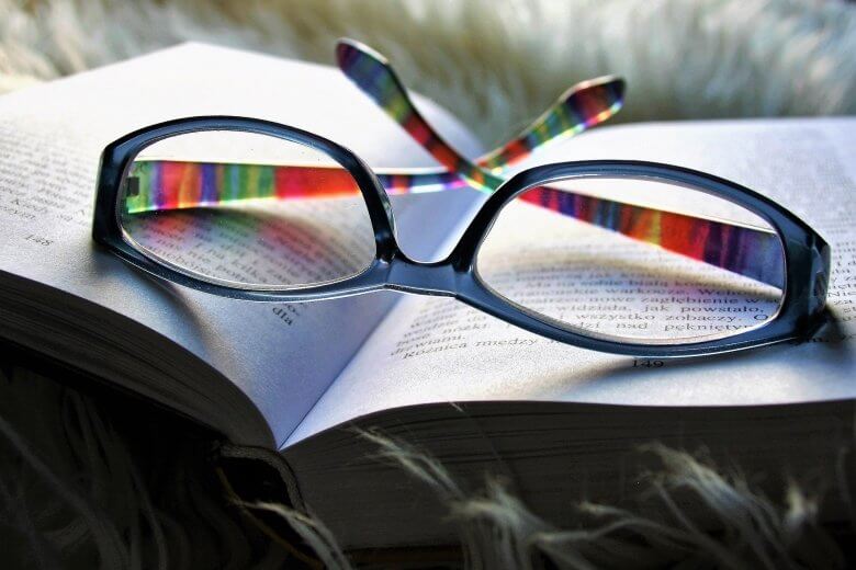 Reading glasses and book