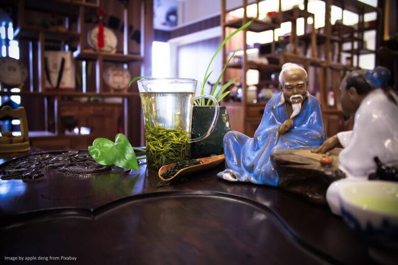 Japanese tea set up with tea master figurines