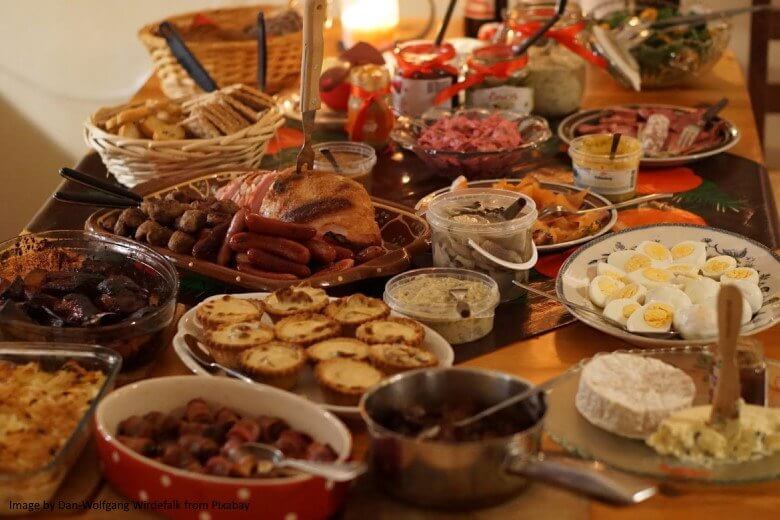smorgasbord for a festive meal with a many dishes hot and cold on a table