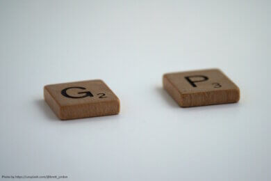 Scrabble letter G and P with a gap between them for the missing A