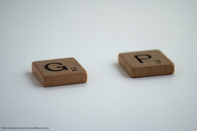Scrabble letter G and P with a gap between them for the missing A
